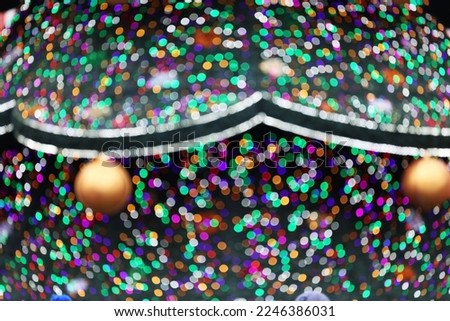 Colorful Christmas background with lights of Christmas trees.