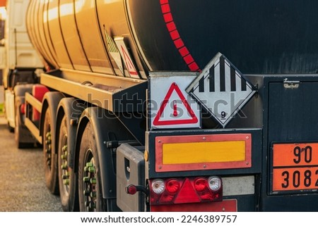 High temperature liquid hazard and miscellaneous hazard label on dangerous goods tank truck. Royalty-Free Stock Photo #2246389757
