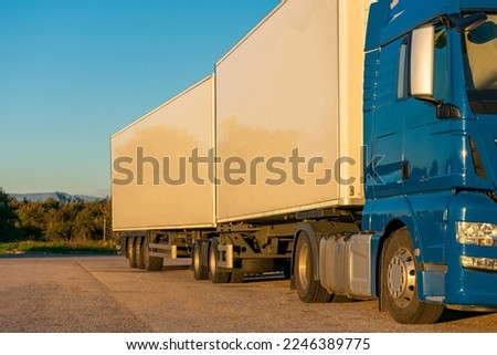 Road train or EMS (european modular system), mega truck with two semi-trailers authorized to transport 60 tons. Royalty-Free Stock Photo #2246389775