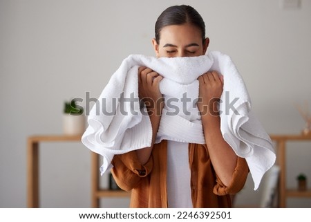Laundry, fresh and woman smelling a towel after cleaning, housework and washing clothes in the morning. Chores, housekeeping and cleaner with smell of clean clothing after a routine wash at home Royalty-Free Stock Photo #2246392501