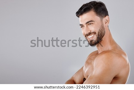 Man, face and smile with beauty and skincare, muscle and glow with cosmetic skin treatment against studio background. Grooming, hygiene and body cleaning mockup with natural cosmetics and wellness Royalty-Free Stock Photo #2246392951