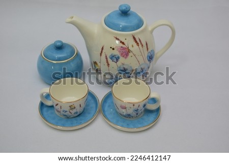  Mock up design set of elegant and traditional porcelain blue and white dainty floral china ceramic tea coffee cup and teapot and saucer set with gold spoon  drinkware isolated on white background