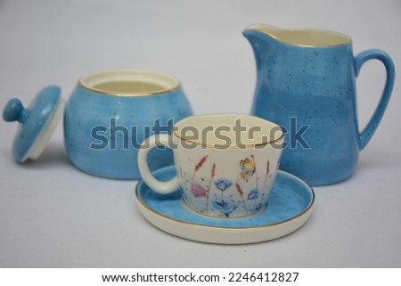  Mock up design set of elegant and traditional porcelain blue and white dainty floral china ceramic tea coffee cup and teapot and saucer set with gold spoon  drinkware isolated on white background