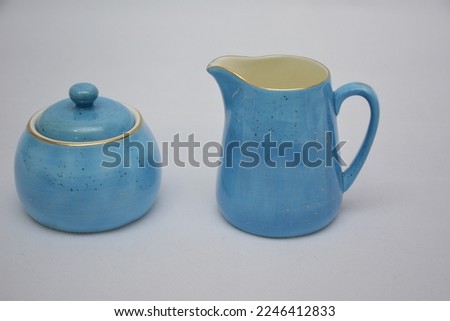  Mock up design set of elegant and traditional porcelain blue and white dainty floral china ceramic tea coffee cup and teapot and saucer set with gold spoon  drinkware isolated on white background Royalty-Free Stock Photo #2246412833