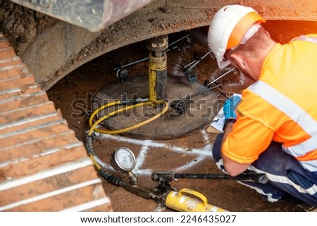 Builder performing ground bearing capacities test on building site Royalty-Free Stock Photo #2246435027