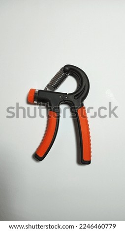 Closeup picture of a hand gripper exercise tool object equipment 