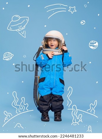 Creative design with drawn elements. Portrait of little boy, child in costume of astronaut over blue background. Funny game. Concept of imagination, childhood, creativity, dreams, ad