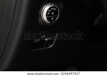 Parking brake of a modern car. Electronic handbrake. Modrn car hand brake, parking button. EPB button. 