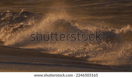 Evpatoria city (Crimea, Crimean peninsula) Waves at dawn during a storm near the Black Sea coast.