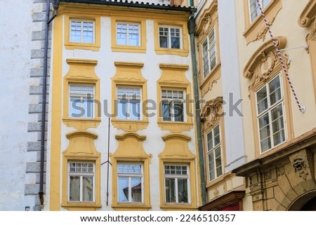 Facade of the house of classical European architecture of the old cozy tourist city. Background with selective focus and copy space