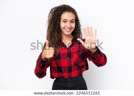 Young Arab woman isolated on white background counting six with fingers