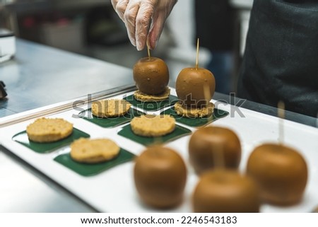 Round-shaped bakery goods - decorating process. Small bakery business. Closeup shot. High quality photo