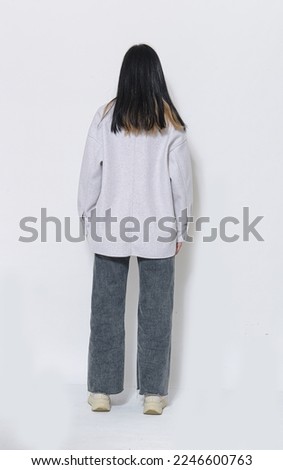 full length of back view young woman poising ,Indoor studio shot on white background Royalty-Free Stock Photo #2246600763