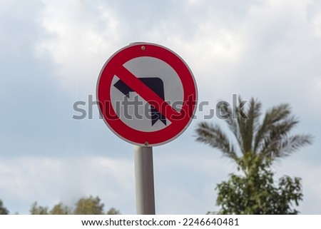 No left turn warning road sign.