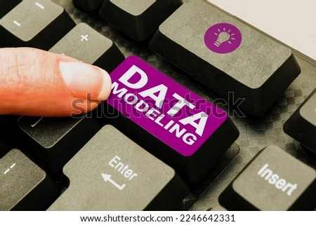 Hand writing sign Data Modeling. Business approach process of transferring data between data storage systems