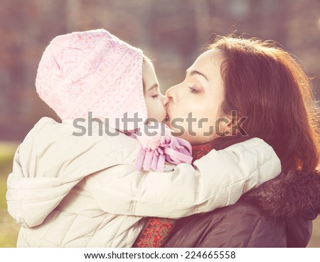 Mother and daughter embracing