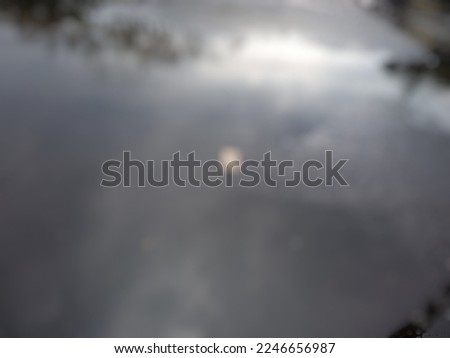 defocused abstract background of puddle