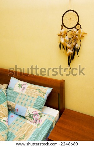 Dreamcatcher above the bed with copyspace