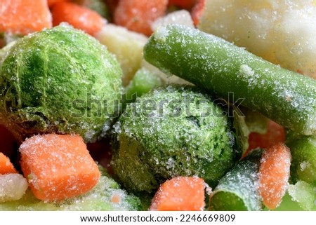 The picture shows fresh frozen vegetables such as broccoli, cauliflower, carrots.
