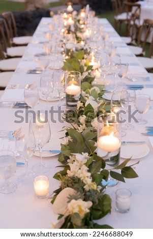 Amazing view on the decorated wedding table for guests