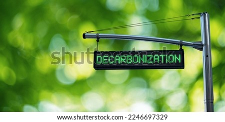Road information board with text DECARBONIZATION on a green background Royalty-Free Stock Photo #2246697329