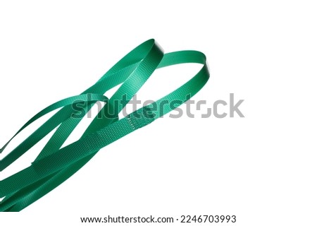 Nylon cord strap for industrial use isolated on white background, close up plastic poly strap for cargo box. Composite cord strapping belt for securing a transport Royalty-Free Stock Photo #2246703993