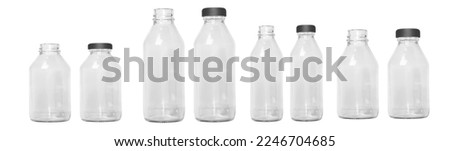 a set of transparent glass bottles of different sizes with a cap, without a cap. Small and large bottles. Empty glass bottles. Royalty-Free Stock Photo #2246704685
