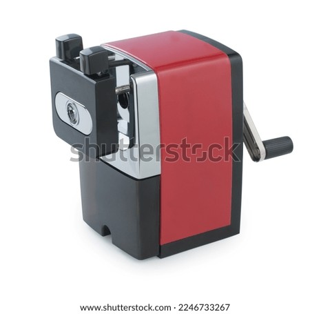 Red mechanical pencil sharpener isolated on a white background. Royalty-Free Stock Photo #2246733267