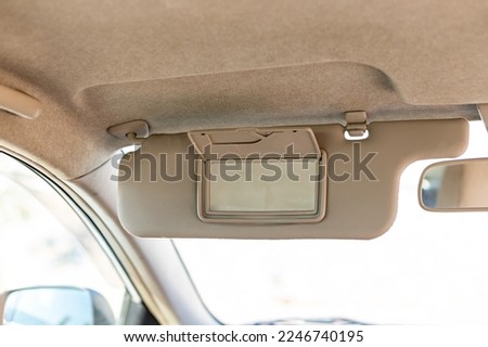Sun visor with mirror in a car Royalty-Free Stock Photo #2246740195