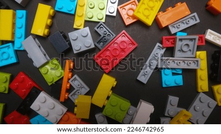 Plastic toy blocks on black background