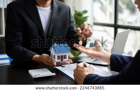 Sales giving male customer signing sales contract, woman and man doing business in office, business concept and contract signing. 

