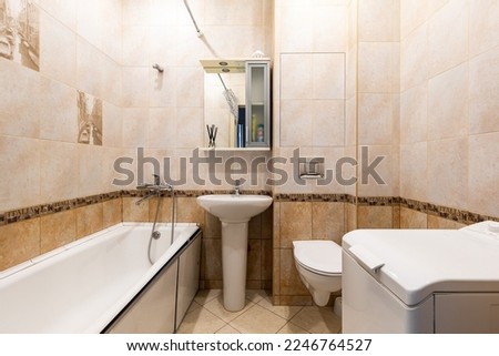 Photo of a bathroom in pastel colors with the lights on