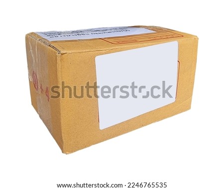 packaging of cardboard parcel box in close-up isolated on white background with clipping path. brown packing parcel box with blank white label for editing. real container box for delivery concept.
