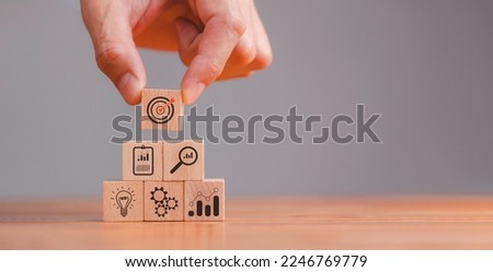 Action plan, Goal and target, business strategy, hand stack woods block step on table with icon about business strategy and Action plan. business development concept. copy space.