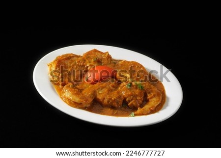 Prawns curry (Shrimp) is a popular Indian delicacy all over India.  Indian cuisine pictures, isolated on Black background.