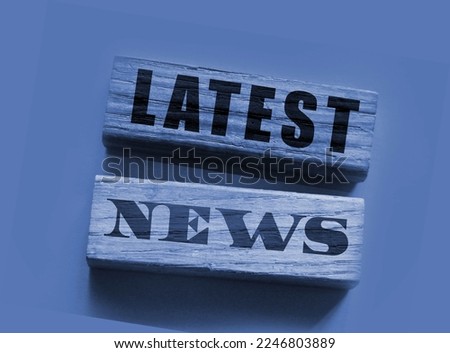 Latest News words on a wooden blocks on yellow and magenta background. Fake or real facts concept. Mass media breaking news concept. Royalty-Free Stock Photo #2246803889