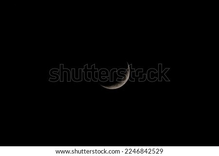A new moon on a calm night with clear sky Royalty-Free Stock Photo #2246842529