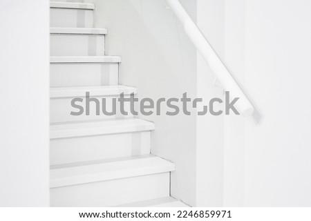 white staircase with steps up Royalty-Free Stock Photo #2246859971