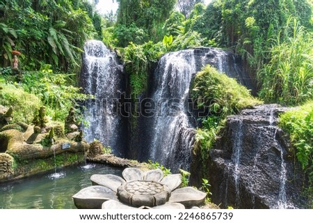 Taman Beji Griya Waterfall. Bali, Indonesia Royalty-Free Stock Photo #2246865739