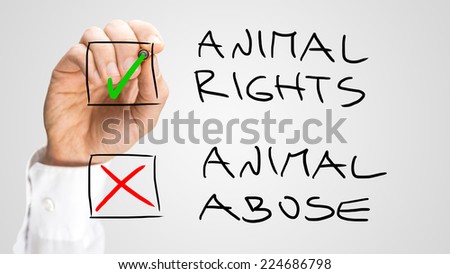 Human Hand Marking Check Boxes for Animal Rights and Abuse List on Gray Background.