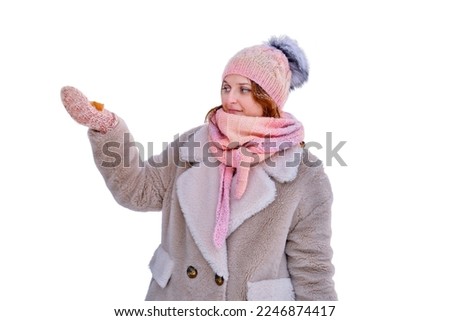 A woman puts bread in a bird feeder, a winter forest with snow-covered trees, isolated on a white background