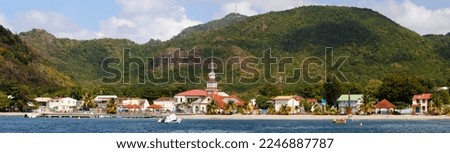 Picture taken in the Anses d Arlets in Martinique. The Anses d Arlets church and the panorama of the Anses d Arlets village in Martinique island, French West Indies.