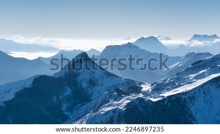 Mountain scenery in the Swiss Alps. Mountains peaks. Natural landscape. Mountain range and clear blue sky. Landscape in the summertime. Large resolution photo.