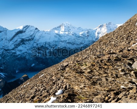Mountain scenery in the Swiss Alps. Mountains peaks. Natural landscape. Mountain range and clear blue sky. Landscape in the summertime. Large resolution photo.