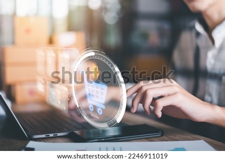 Analysis of online merchandising business reports, with charts and market statistics, shopping carts and promotional items, ecommerce concept and online selling website  Royalty-Free Stock Photo #2246911019