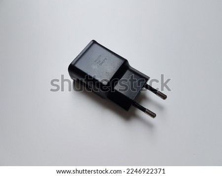 Mobile charger head on a white background.