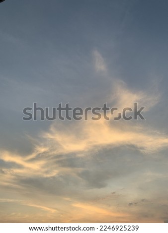 Altostratus clouds in the sky is a fiber of yellow and blue cover part of the sky at Bangkok, Thailand.no focus