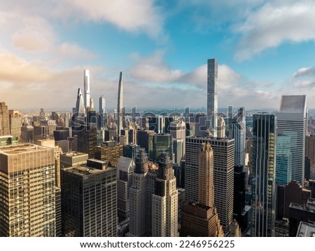 New York City Manhattan panorama with tall thin skyscrapers next to Central Park