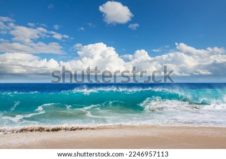 Blue wave on the beach. Dramatic natural background.