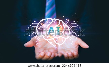 Circuit board in shape electronic brain, symbol Ai hanging over hand. Digital image of the brain on the palm. Artificial Intelligence, AI Technology. Business analysis, innovation, technology